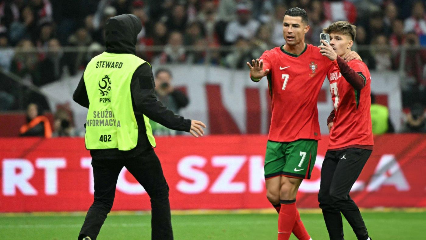 
Cristiano Ronaldo shields pitch invader from security in touching gesture 